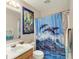 Whimsical bath includes vanity, showerhead, and themed curtain in front of the tub and shower area at 9243 Crossing Dr, Fishers, IN 46037