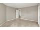 Neutral bedroom with an open door and trim throughout the space at 9243 Crossing Dr, Fishers, IN 46037