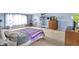 Bright bedroom with a bed and a large window, showcasing a cozy interior at 9243 Crossing Dr, Fishers, IN 46037