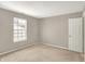 Bright bedroom features a large window and a closet with white trim throughout the space at 9243 Crossing Dr, Fishers, IN 46037