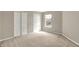 Bright bedroom with double closets and a window that offers neighborhood views at 9243 Crossing Dr, Fishers, IN 46037