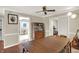 Traditional dining room with hardwood floors, decorative cabinet, and modern light fixture at 9243 Crossing Dr, Fishers, IN 46037