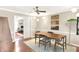 Cozy dining room with a wooden table set, overhead lighting, and view into adjacent spaces at 9243 Crossing Dr, Fishers, IN 46037