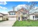 Well-maintained two-story home featuring brick and siding, a two-car garage, and a lovely front yard at 9243 Crossing Dr, Fishers, IN 46037
