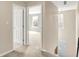 Hallway with doorways to bedrooms and a staircase, showcasing the home's layout at 9243 Crossing Dr, Fishers, IN 46037