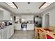 Modern kitchen boasts tile floors, stainless steel appliances, and white cabinetry at 9243 Crossing Dr, Fishers, IN 46037