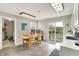 Eat-in kitchen with access to patio and a breakfast nook with a table at 9243 Crossing Dr, Fishers, IN 46037