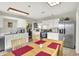 Spacious kitchen featuring stainless steel appliances, and adjacent breakfast nook with seating at 9243 Crossing Dr, Fishers, IN 46037