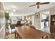Open concept living room features hardwood floors, dining area, and access to the kitchen at 9243 Crossing Dr, Fishers, IN 46037