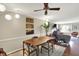 Cozy living room boasts hardwood floors, overhead fan, and a modern exercise machine at 9243 Crossing Dr, Fishers, IN 46037