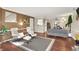 Open living area with modern furniture, hardwood floors, and natural light creates a comfortable gathering space at 9243 Crossing Dr, Fishers, IN 46037