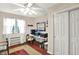 Office area featuring hardwood floors, closet, and natural light from window at 9243 Crossing Dr, Fishers, IN 46037