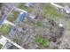 An aerial view features a neighborhood with homes nestled among mature trees and spacious yards at 9923 N 125 W, Fortville, IN 46040