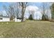 This backyard features a tree and white storage shed at 9923 N 125 W, Fortville, IN 46040