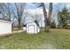 The backyard features a large shade tree and white storage shed at 9923 N 125 W, Fortville, IN 46040