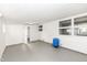 Spacious basement with painted floor, multiple windows, and access to a utility area at 9923 N 125 W, Fortville, IN 46040
