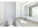 Bathroom vanity featuring white cabinets and granite countertop, with modern fixtures at 9923 N 125 W, Fortville, IN 46040