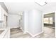 Bright entryway featuring gray walls, modern flooring, and access to other rooms in the house at 9923 N 125 W, Fortville, IN 46040