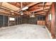 The unfinished garage features concrete floors, exposed rafters, and window at 9923 N 125 W, Fortville, IN 46040