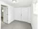 Hallway featuring neutral paint, access to additional rooms and a window at 9923 N 125 W, Fortville, IN 46040