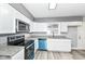 Kitchen featuring white cabinets, granite countertops and blue appliances at 9923 N 125 W, Fortville, IN 46040