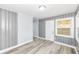 Cozy living room featuring wood paneling, modern flooring and a front door entrance at 9923 N 125 W, Fortville, IN 46040