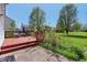 Cozy backyard deck featuring outdoor chairs and clear view of lawn at 10576 Greenway Dr, Fishers, IN 46037