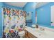 Colorful bathroom with a shower and a large vanity at 10576 Greenway Dr, Fishers, IN 46037