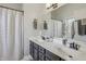 Bathroom featuring a double sink vanity and modern fixtures at 10576 Greenway Dr, Fishers, IN 46037