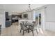 Inviting dining area with a view of the kitchen, a dining table, and sliding glass doors at 10576 Greenway Dr, Fishers, IN 46037