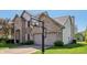 Two-story brick home featuring an attached two-car garage and a basketball hoop at 10576 Greenway Dr, Fishers, IN 46037