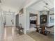 Spacious foyer leading to a dining area, featuring tiled floors and a coat rack at 10576 Greenway Dr, Fishers, IN 46037