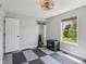 Bright home gym with rubber flooring, and a window with backyard views at 10576 Greenway Dr, Fishers, IN 46037