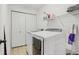 Neat laundry room with washer, dryer, and ample storage space at 10576 Greenway Dr, Fishers, IN 46037