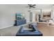Cozy living room with modern furniture, a TV, and a view into the kitchen at 10576 Greenway Dr, Fishers, IN 46037