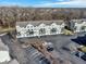 Aerial shot of condo buildings with balconies, garage access, and ample parking space at 1074 Reserve Way, Indianapolis, IN 46220