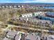 Aerial view showcasing a condo community with a lake, and diverse residential architecture at 1074 Reserve Way, Indianapolis, IN 46220