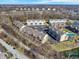 Aerial view of a condo community with a lake, pool, and various architectural styles at 1074 Reserve Way, Indianapolis, IN 46220