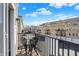 Enjoy a morning coffee on this balcony, featuring comfortable chairs and a table at 1074 Reserve Way, Indianapolis, IN 46220