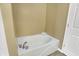 Bright bathroom featuring a clean white bathtub and tile flooring at 1074 Reserve Way, Indianapolis, IN 46220