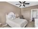 This bedroom features carpet, a ceiling fan, a closet, and an ensuite bathroom at 1074 Reserve Way, Indianapolis, IN 46220