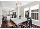 Dining room with an eat-in kitchen, with lots of light from the windows, and a modern lighting fixture at 1074 Reserve Way, Indianapolis, IN 46220