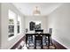Bright dining area with large windows and hardwood floors, offering a cozy space for Gathering meals at 1074 Reserve Way, Indianapolis, IN 46220