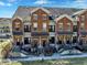 Beautifully designed brick townhouses with inviting entrances and well-kept landscaping at 1074 Reserve Way, Indianapolis, IN 46220