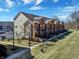 Charming townhouses featuring a blend of brick and siding, set against a backdrop of blue skies at 1074 Reserve Way, Indianapolis, IN 46220