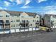 View of the lovely condo complex, featuring attached garages and private balconies at 1074 Reserve Way, Indianapolis, IN 46220