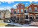 Attractive townhomes feature red brick and charming front patios and stairways at 1074 Reserve Way, Indianapolis, IN 46220