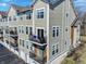 Close-up view of condo building with garage access, small balconies, and natural light at 1074 Reserve Way, Indianapolis, IN 46220