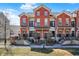 Charming townhomes feature brick facade, black accents, and inviting entryways at 1074 Reserve Way, Indianapolis, IN 46220