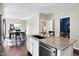 Bright eat-in kitchen featuring stainless appliances, a center island with granite, and access to the dining area at 1074 Reserve Way, Indianapolis, IN 46220